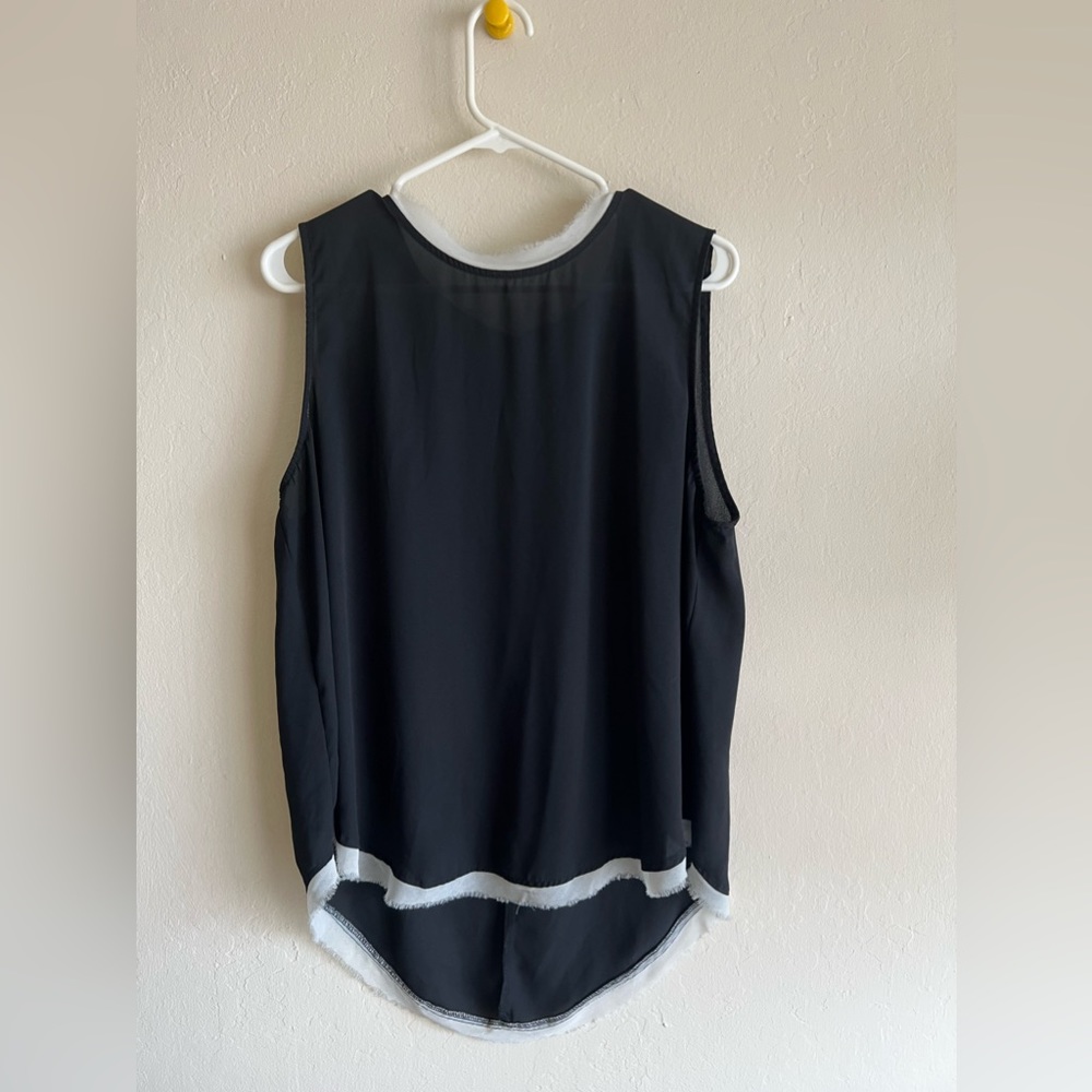 Black blouse with white tattered edges